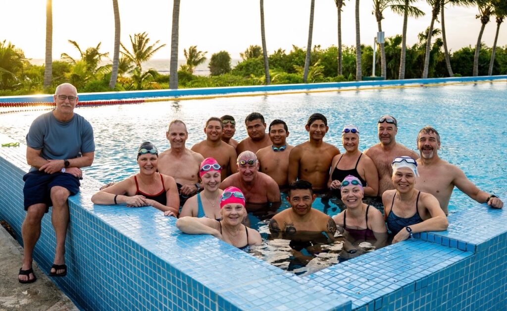 Technosport swimmers group photo in the pool at the Cancun training camp